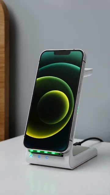 Phone charges upright with an ambient status glow
